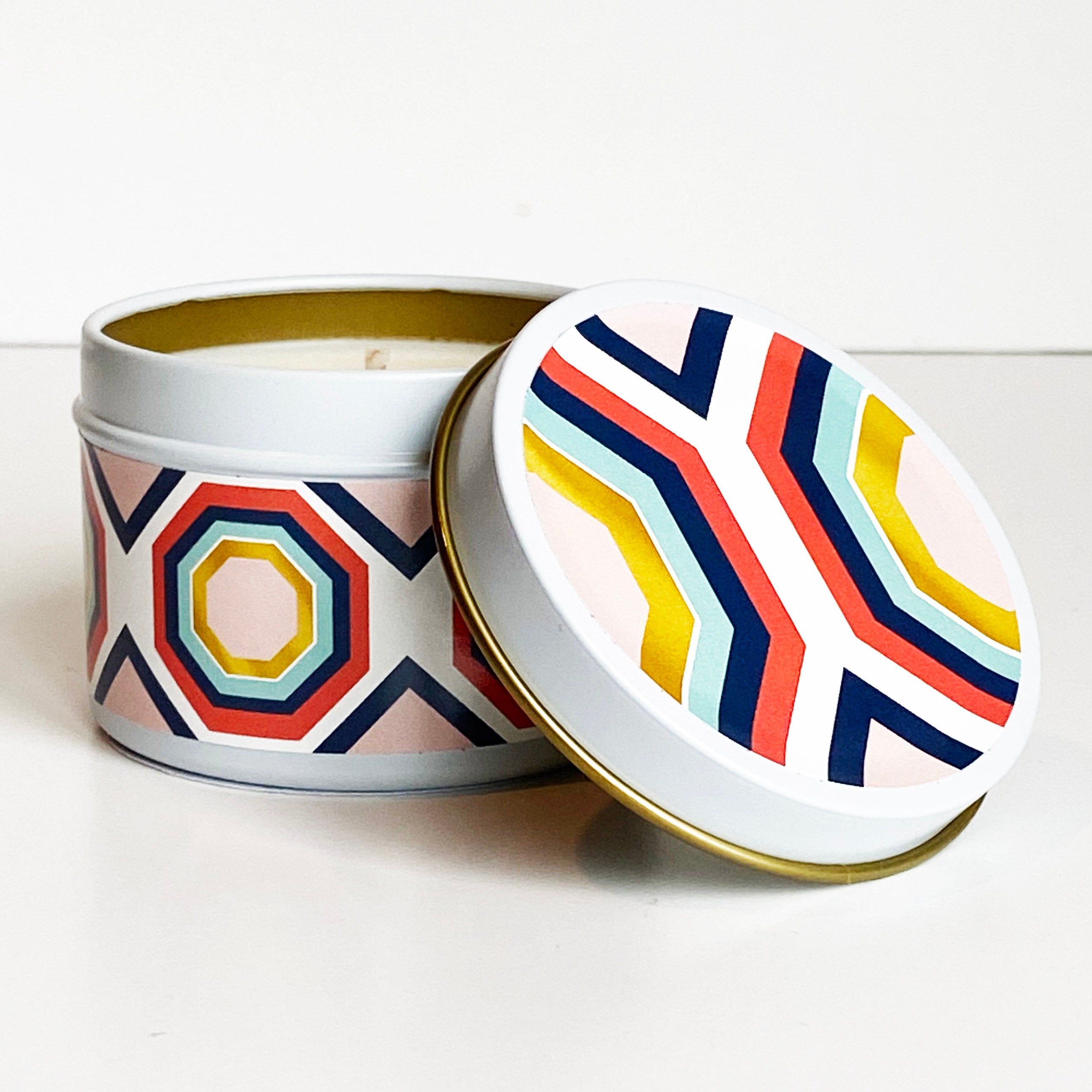 Bring a touch of mid-century modern style to your travels with our Hexagon Blush and Blue Travel Candle! Its trendy blush and blue color palette and delectable blueberry cheesecake scent combined with a hexagon pattern add a stylish touch to any space. For on the go or as a gift, our travel candle will bring a cozy and inviting ambiance wherever you are. Perfect for a nightstand, office desk or bathtub, Fun for party giveaways, and makes a great gift too!
