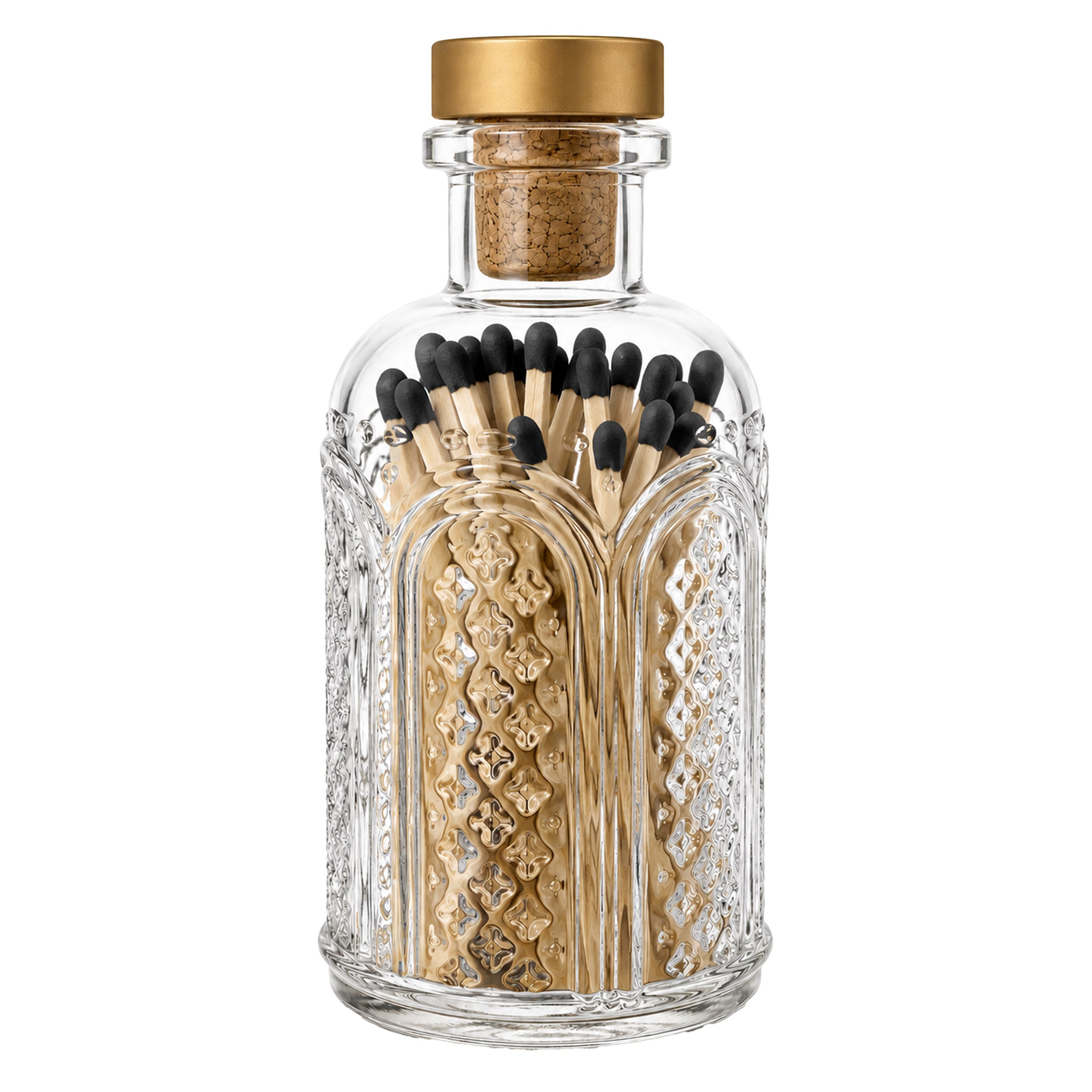 A clear glass bottle with a gold screw cap and a cork insert, filled with decorative gold-toned matchsticks with black tips, shown on a plain white background.