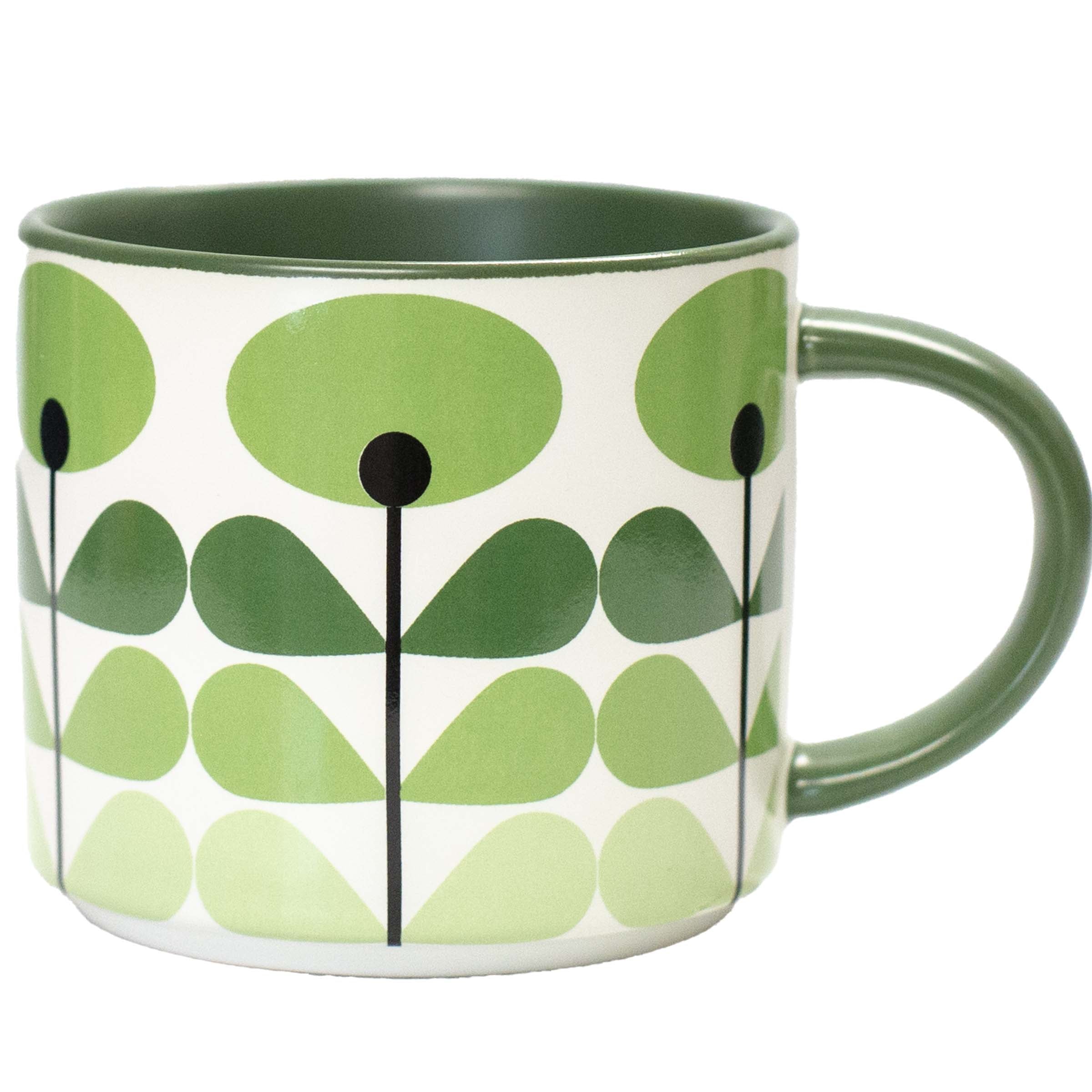 A ceramic mug featuring a retro mid-century modern pattern of green stylized leaves and stems on a white background, with a solid dark green interior and handle.