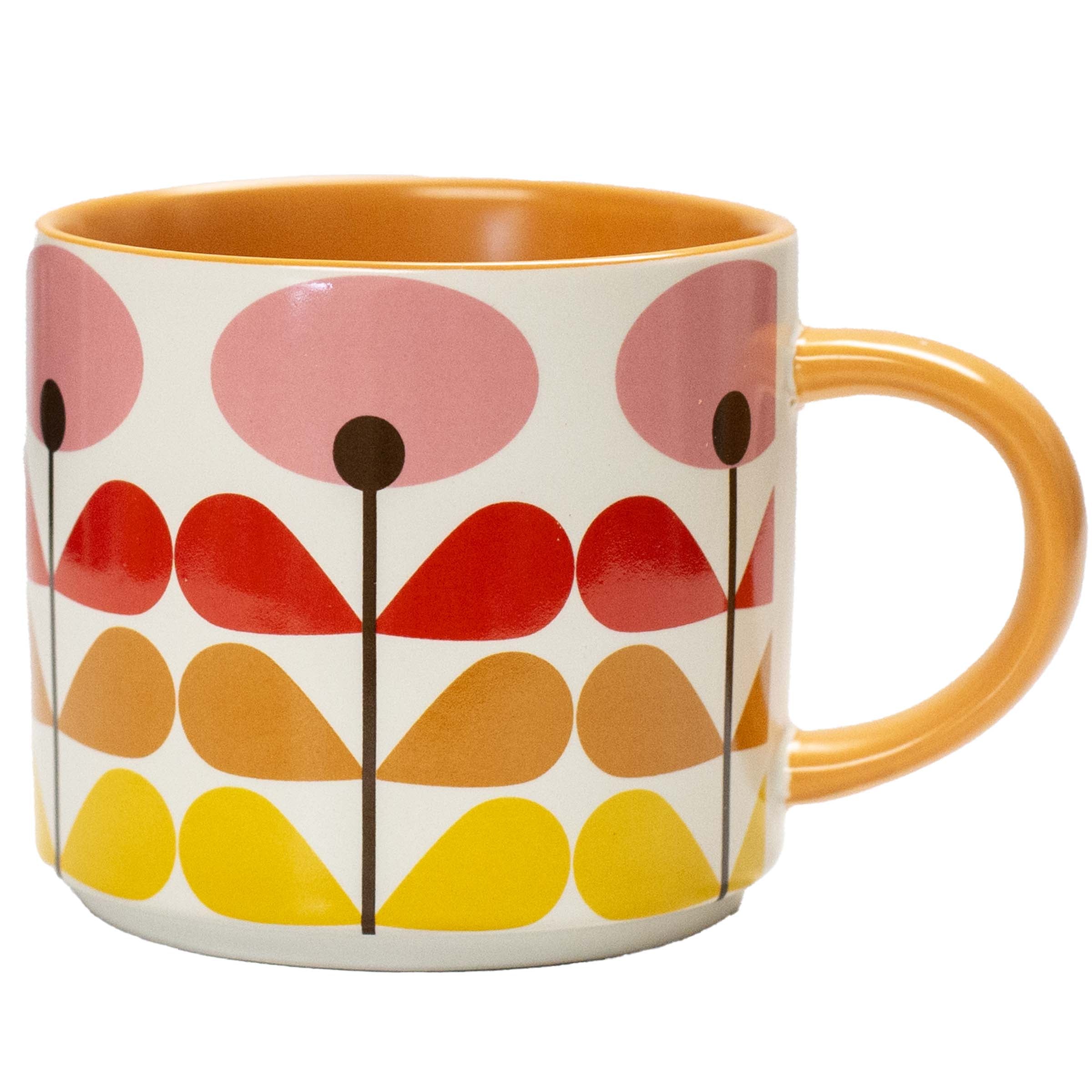 A ceramic mug featuring a retro mid-century modern floral pattern with pink, red, orange, and yellow shapes on a white background, with a solid orange handle and interior.