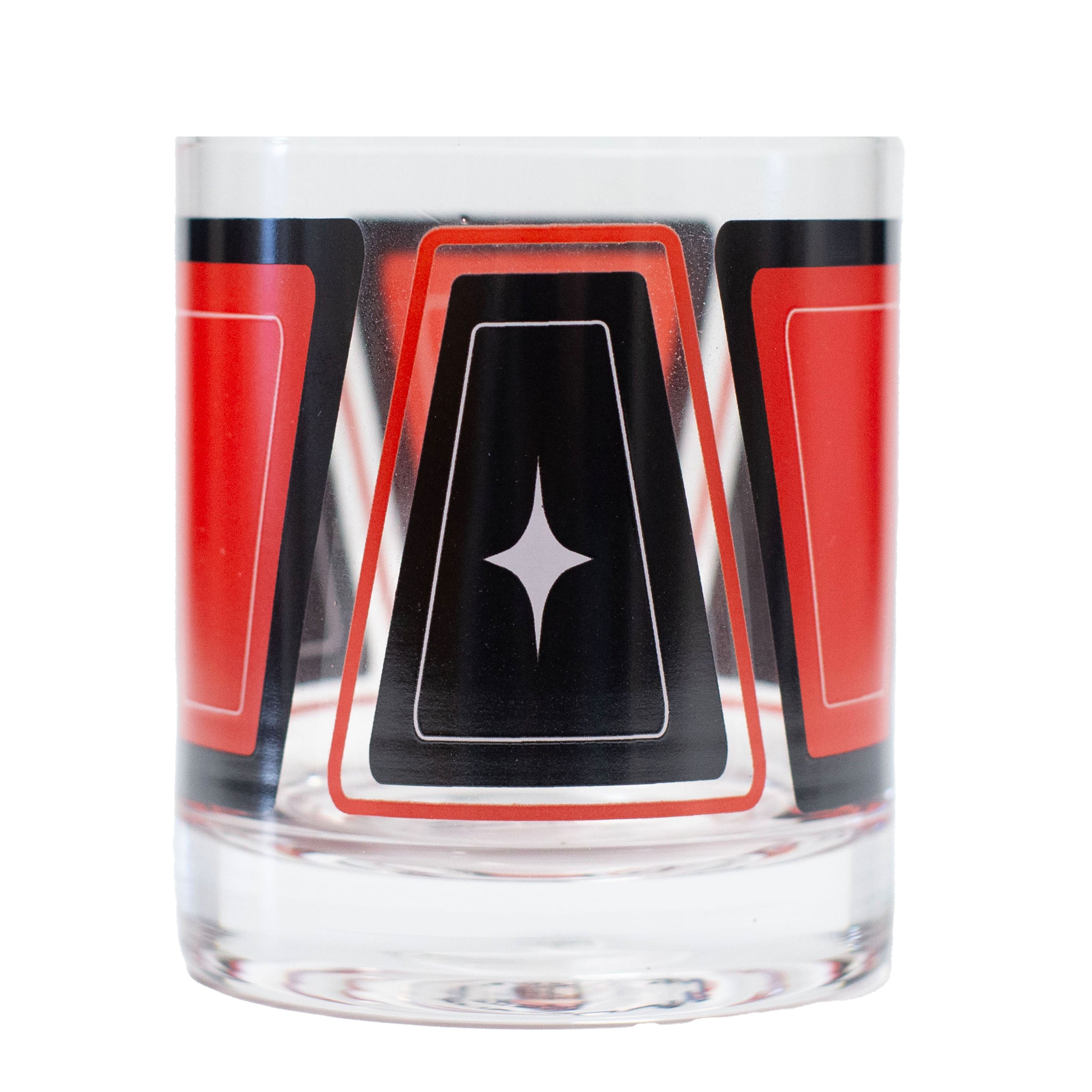 Clear whiskey rocks glass with red and black geometric retro mid century modern design 