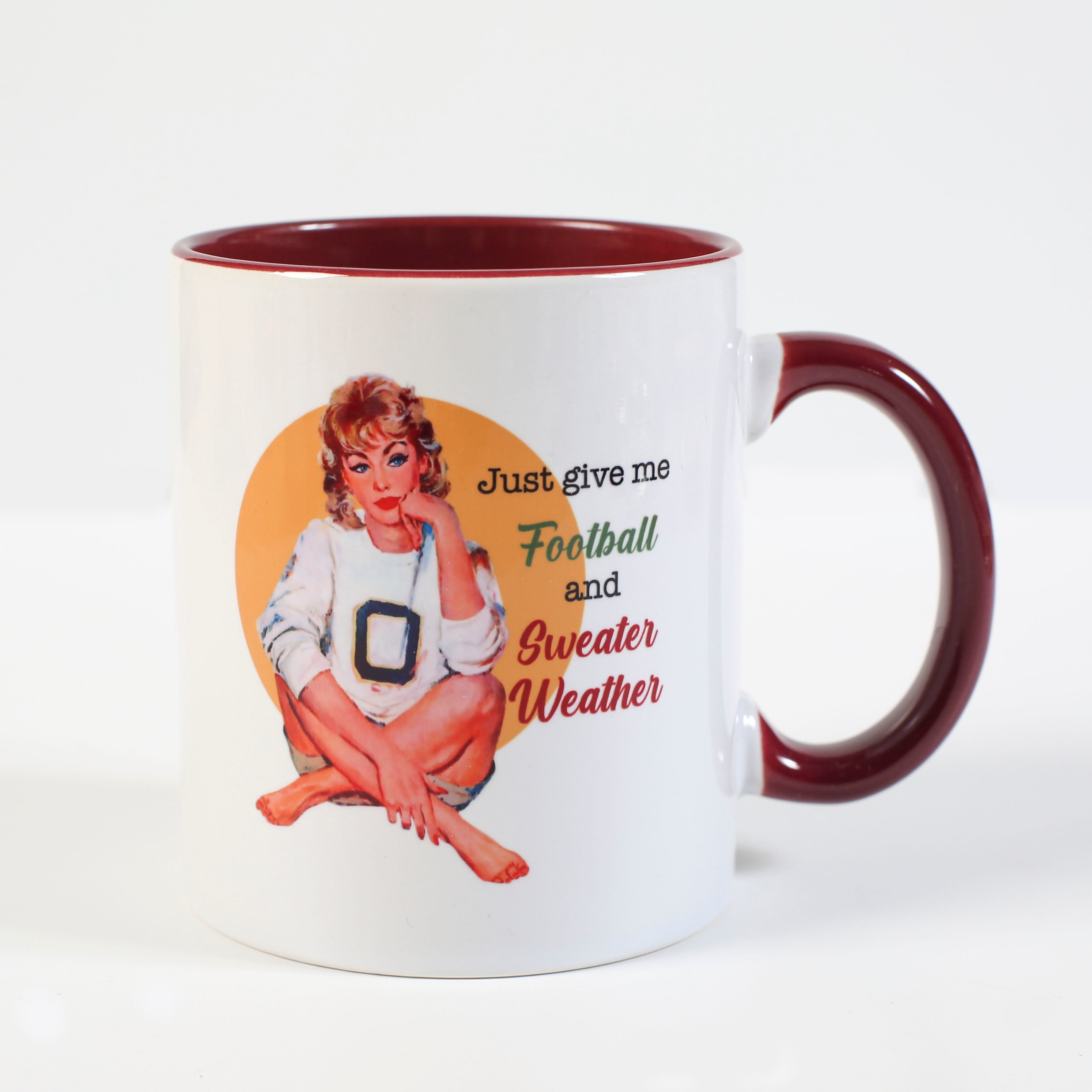 Celebrate sweater weather and football with this charming pinup housewife coffee mug! This cup features Fall feels in a classic pinup style, with a contrasting inside and handle to match. Hot chocolate, apple cider or pumpkin spice lattes...whichever you prefer, it'll have you ready to tackle the season in style!