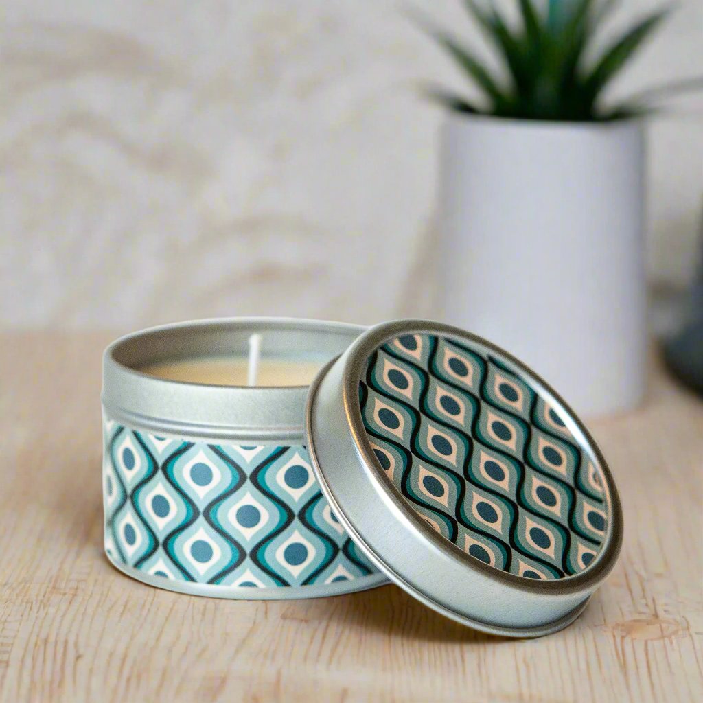 Transform any space into a stylish oasis with our Circle In Waves Mid Century Modern Travel Candle. Featuring a sleek geometric design, this candle comes in a silver tin for easy on-the-go use, making it the perfect companion for travel or a thoughtful gift.